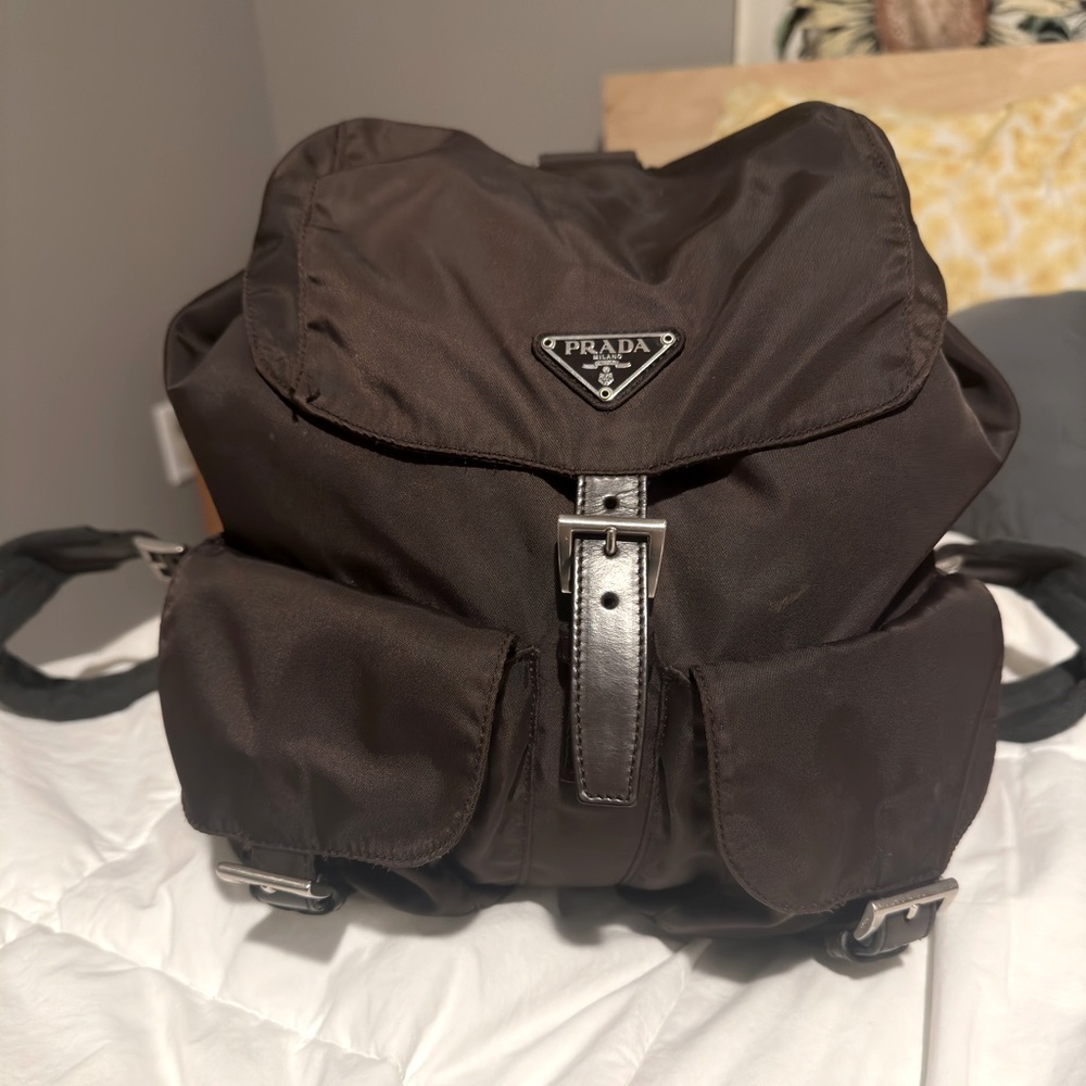 Authentic Prada mini backpack in brown, lightly used.